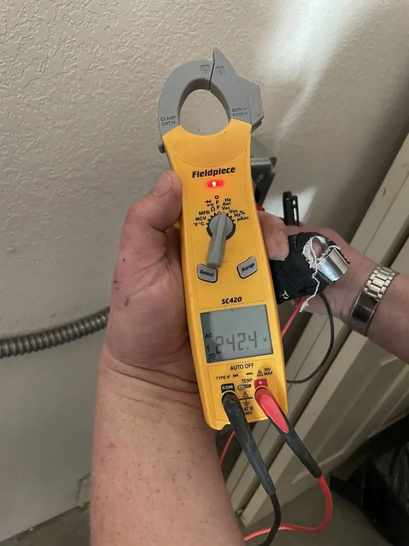Voltage testing with clamp meter during Circuit Breaker Repair in Hancock